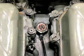 Photo shows the area on the Coast Guard cutter Spencer’s diesel engine where the MIT-developed “NILM Dashboard” detected damage that could have caused a fire. The damage was hidden under the brown cap at center.