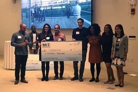Symbrosia co-founder and CEO Alexia Akbay, second from left, and co-founder and CTO Jonathan Simonds, fourth from right, pose with members of MIT’s Water Club following the MIT Water Innovation Prize Thursday.