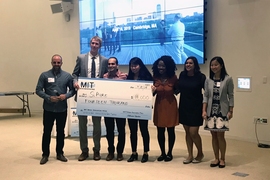 SiPure co-founders Brendan Smith, second from left, and Lily Cheng Zedler, fourth from right, pose with members of MIT’s Water Club following the Water Innovation Prize Thursday.