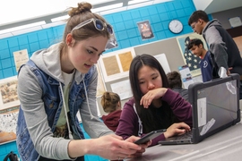 MIT PhD student Jess V works with Cambridge Rindge and Latin student on App Inventor. 