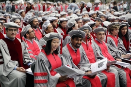 An array of new MIT doctoral graduates seated at the Institute’s Investiture of Doctoral Hoods and Degree Conferral ceremony in MIT’s Killian Court.