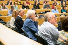 MIT Professor Bengt Holmström (center), the 2016 Nobel laureate in economics, sits in the audience at the press conference.
