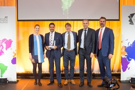 Members of Agros, a company using remote sensing and precision agriculture to assist small farmers in Latin America, pose with IIC organizers and sponsors after winning the $250,000 grand prize in the technology access category.