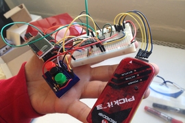 Jose Gomez-Marquez holding an open glucometer prototype at MIT Little Devices Lab