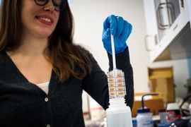 MIT graduate student Emily Hanhauser demonstrates a new device that may simplify the logistics of water monitoring for trace metal contaminants, particularly in resource-constrained regions.