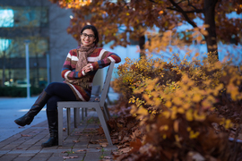 Nidhi Juthani sitting outside on MIT campus