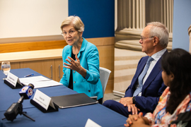 Warren speaking at a roundtable