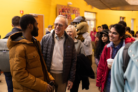 President L. Rafael Reif speaks with a circule of community members in the crowded Stata Center
