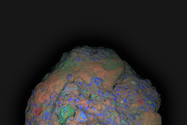 The concrete fragment is colorized with rainbow colors, including a prominent section colored red.