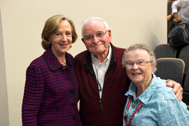 Group photo with Susan Hockfield, left, and Paul and Priscilla King Gray inside an MIT room.
