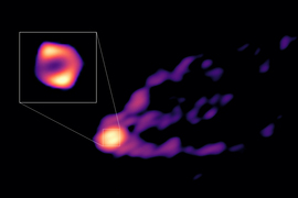 A very blurry image shows a bright white and yellow oval with purple bits flowing off it to the right, which are the jet and shadow of the black hole. In an inset, the bright oval is more like a blurry ring with a hollow center and bright white bulges on top and bottom.