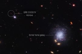 An image of space, with the label “GRB 230307A kilonova” marking the red dot of the kilonova, on top left. A label says “former home galaxy,” and links to a small but crowded galaxy with many bright lights, on bottom right.