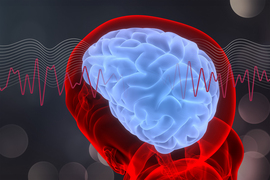 Glowing human brain illustration with brain waves crossing through center horizontally.