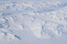 Aerial photo of snow-covered valleys.