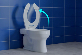 The new Cleana toilet. An arrow shows how the seat opens and closes automatically.