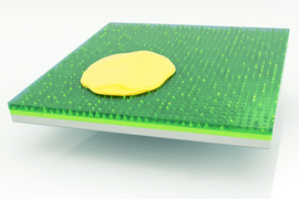 Rendering of a yellow liquid on a green slick material.
