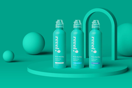 Three bottles of Revel say, “Revel! It’s in the Bag. Deodorizing Lubricant,” and they are labeled “Unscented, Eucalyptus, and Lavender.” The background and bottles are mint green.
