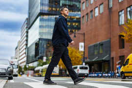 Andres Sevtsuk portrait while crossing the street.