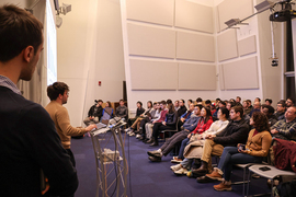 Two people present to an audience at MIT’s Stata Center