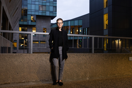 Ariel White stands with MIT building in background