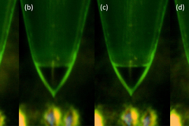 Four closeup shots of the tiny emitter show the droplet forming.