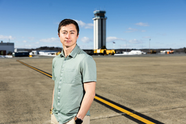 Randall Pietersen standing on Hanscom Field tarmac