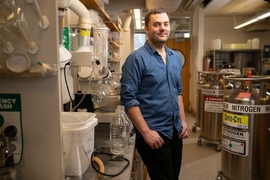 Daniel Suess stands in the lab.