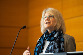 Sally Kornbluth speaks at the podium.