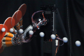 Time lapse shows ping pong paddle hitting ball.