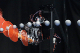 Time lapse shows ping pong paddle hitting ball.