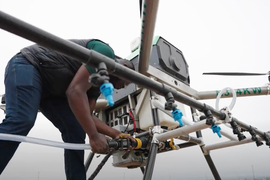 A large drone delivering supplies to a mountainous location