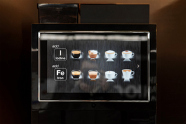 A coffee vending machine with buttons to add iron and iodine