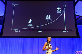 A female student presenting on stage
