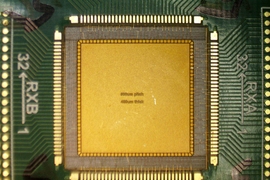High-resolution microscope captures of the empty square, yellow, surrounded by an array and thin copper wires.