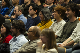 Closeup of a dozen or so audience members, several smiling or laughing
