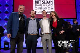 Four people pose for portrait on stage with the text "MIT Sloan Sports Analytics Conference 2026" behind them.
