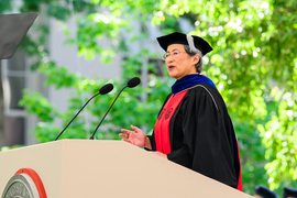 Lisa Su speaks at a podium