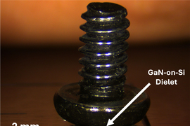 A small golden metal at the bottom of a screw flipped upside down for comparison. An arrow of 2mm indicates the small size of the metal, labeled as “Gan-on-Si dielet.”