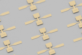  An array of the devices, which look like two crossed paddles creating a “t.” 