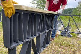 Close-up shows that the trusses are 3-D printed.