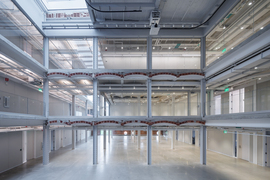 An open triple-height space inside the warehouse