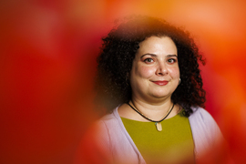 Christina Delimitrou portrait surrounded by a red blur.
