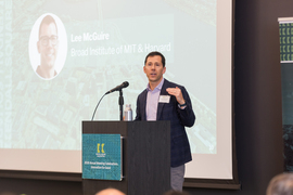 Lee McGuire speaks at podium