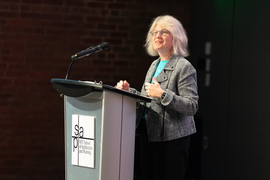 Sally Kornbluth at the podium.