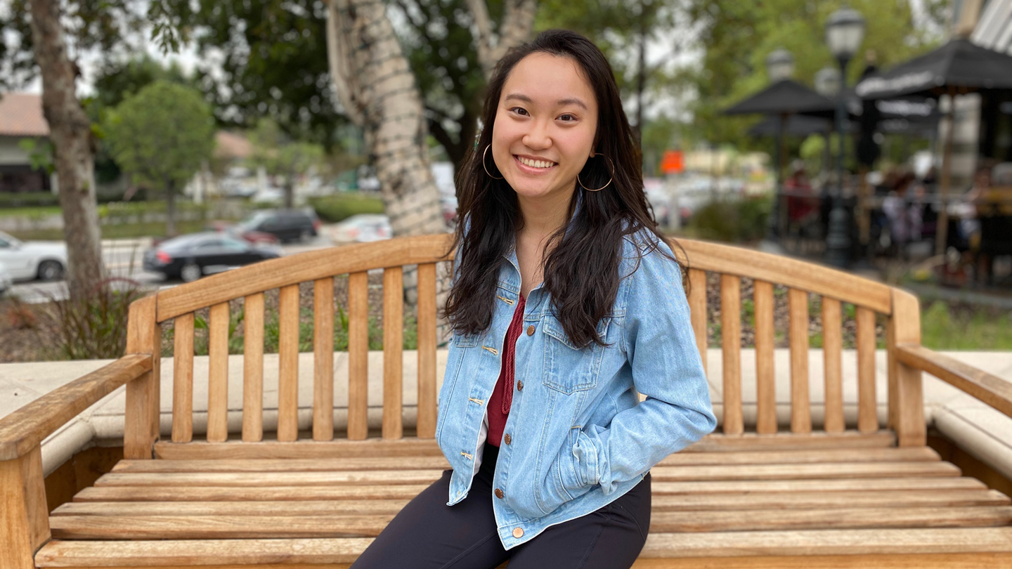 MIT student Ayesha Ng sitting on park bench