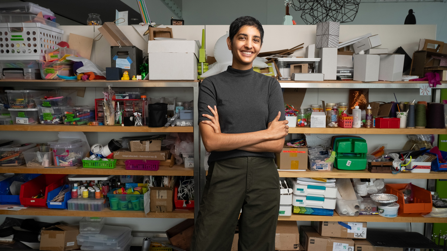 Ila Kumar portrait in front of shelves full of art and craft supplies.