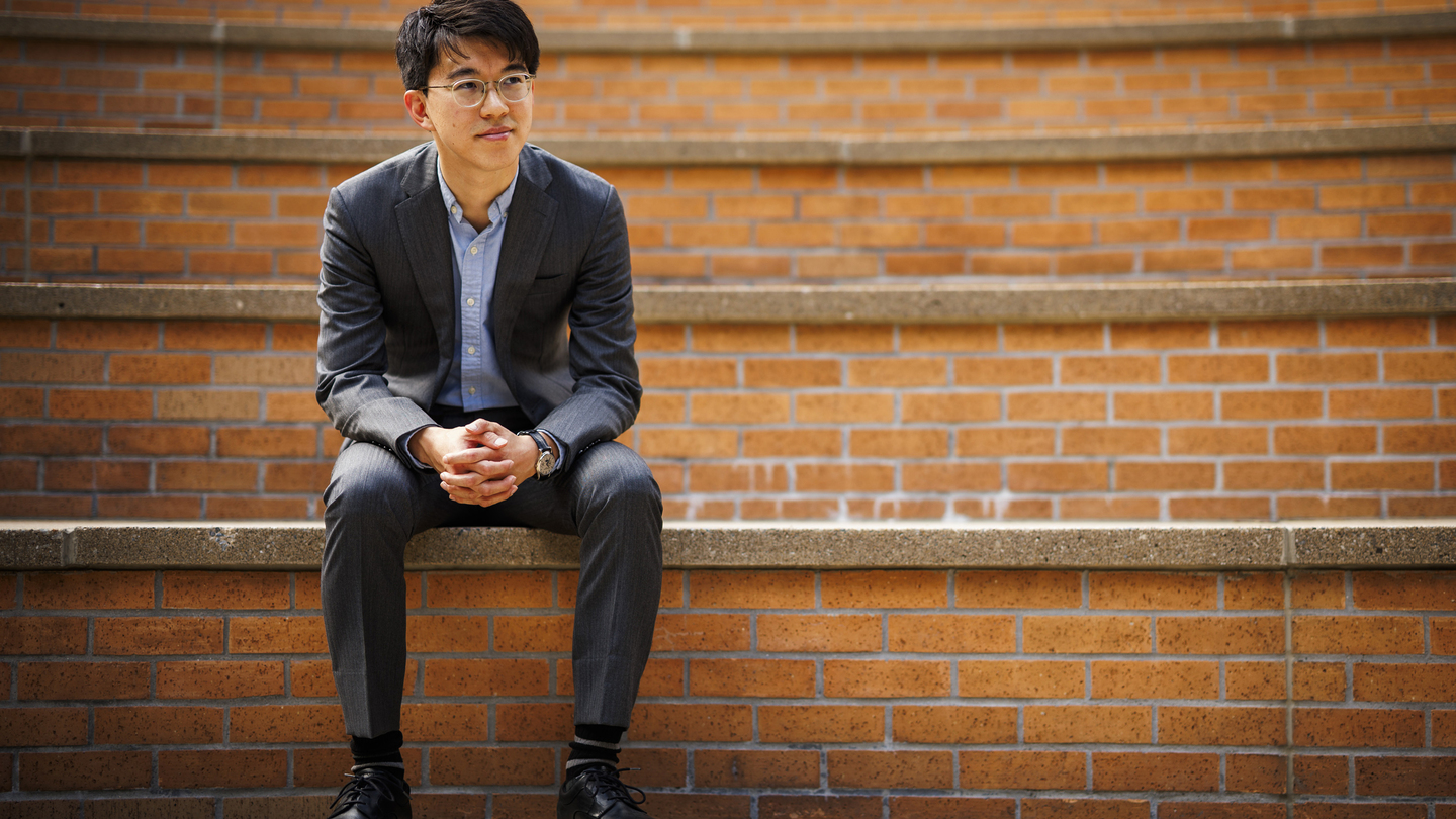 Naoki Egami sits on amphitheater stairs