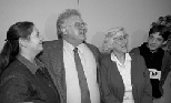 1998 Nobel Laureate Robert Laughlin is flanked by his wife, Anita, left, and his mother, Peggy, while his son, Todd, looks on at a Stanford University news conference on Oct. 13, 1998.