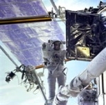 NASA astronaut John M. Grunsfeld (SB 1980) conducts a space walk during last month's space shuttle mission to repair the Hubble Space Telescope. Dr. Grunsfeld is at the end of Discovery's remote manipulator system as he prepares to replace a radio transmitter in one of Hubble's electronics bays.