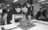 Testing their entry before the 6.270 contest are Joe Levine (left), a junior in mathematics, and one of his partners, Steve Park, a senior in electrical engineering and computer science.